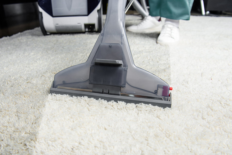 carpet vacuuming in progress